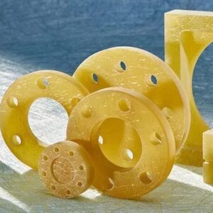 A group of yellow plastic parts sitting on top of a floor.