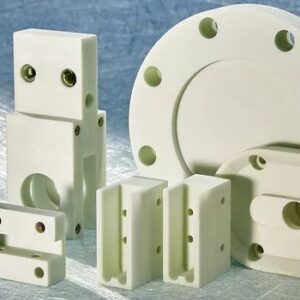 A group of white plastic parts sitting on top of a table.