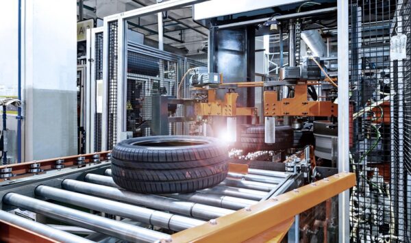 A tire is being made on the conveyor belt.